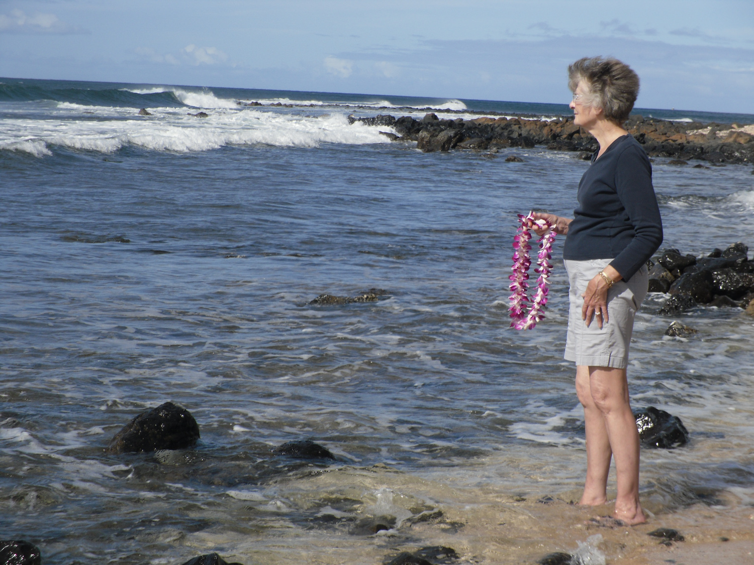 Placing of memorial lei at Salt pond beach